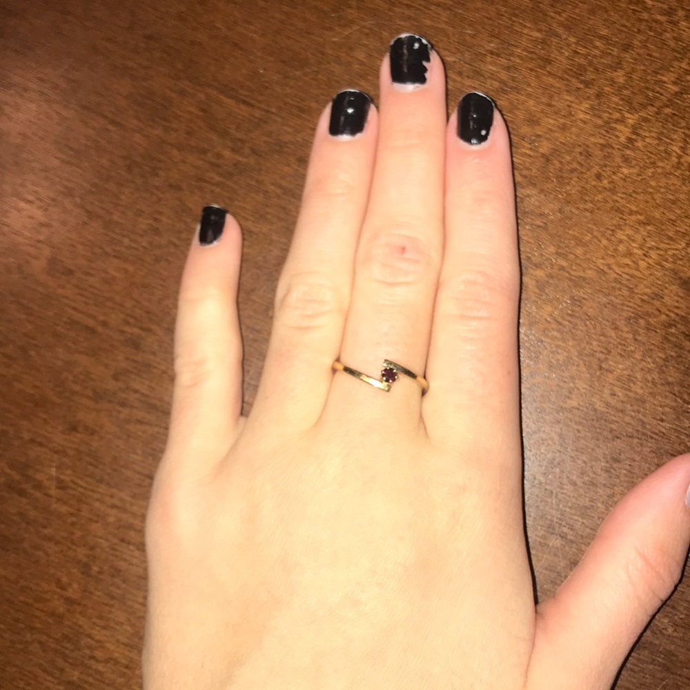 a gold ring with a real ruby diamond